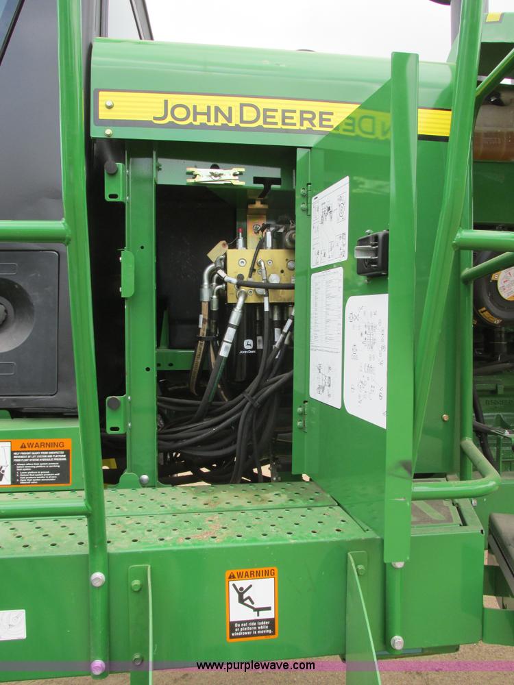 image for item I2543 2013 John Deere R450 SP self-propelled windrower