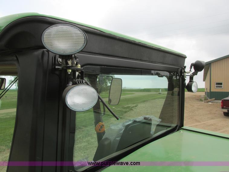 image for item I2543 2013 John Deere R450 SP self-propelled windrower