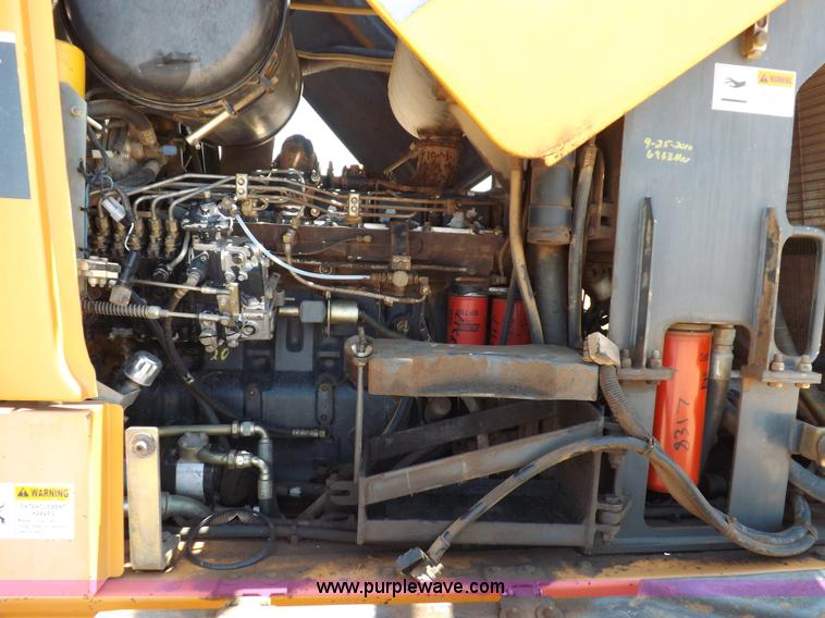 image for item H1799 2004 Case 865 DHP articulated motor grader