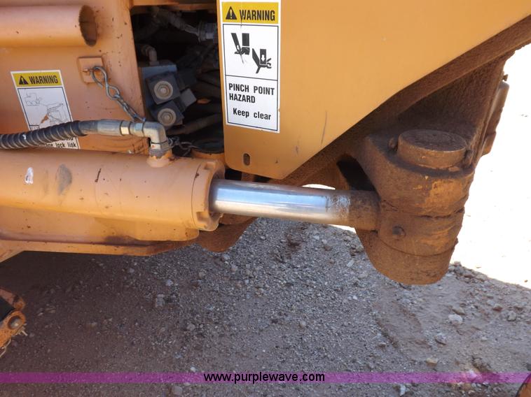 image for item H1799 2004 Case 865 DHP articulated motor grader