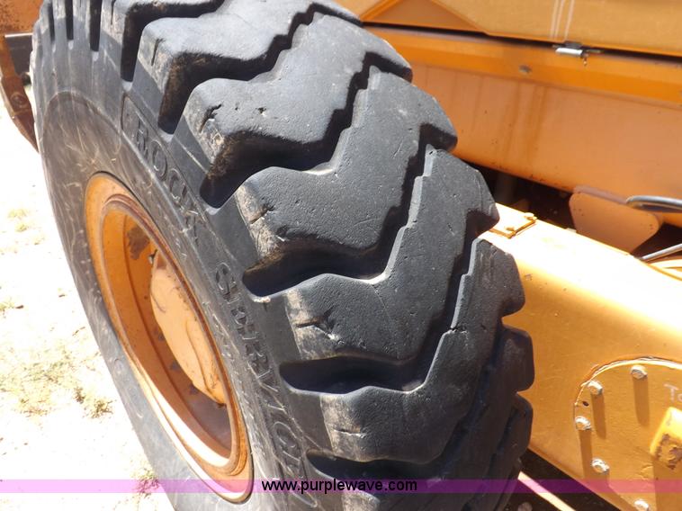 image for item H1799 2004 Case 865 DHP articulated motor grader