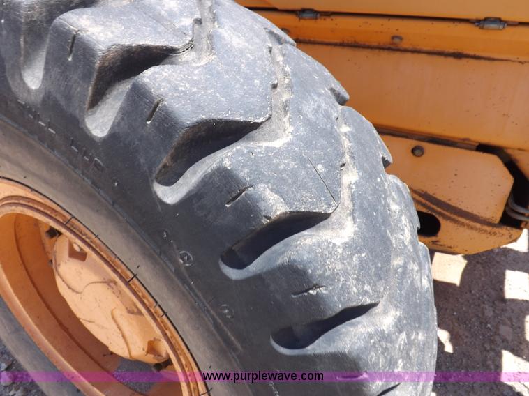 image for item H1799 2004 Case 865 DHP articulated motor grader