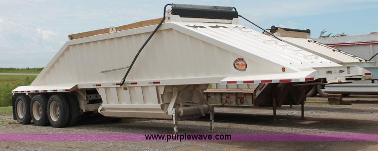 image for item H5641 2007 Construction Trailer Specialist, Inc. BDT-42 triple axle belly dump trailer