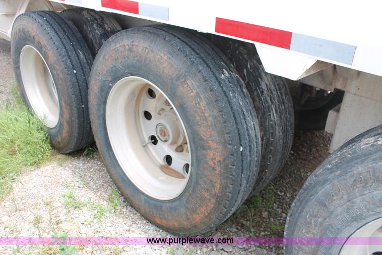 image for item H5641 2007 Construction Trailer Specialist, Inc. BDT-42 triple axle belly dump trailer