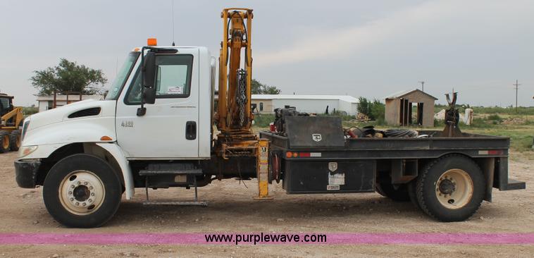 image for item C3934 2003 International DuraStar 4300 flatbed truck with crane