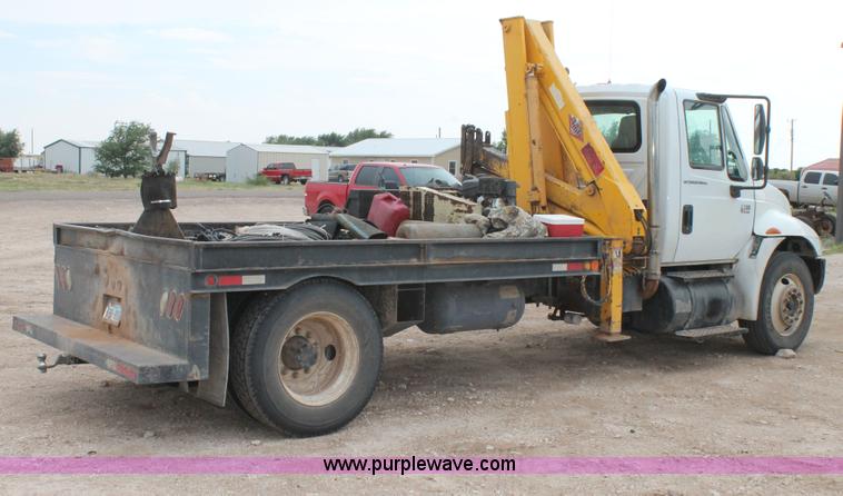 image for item C3934 2003 International DuraStar 4300 flatbed truck with crane