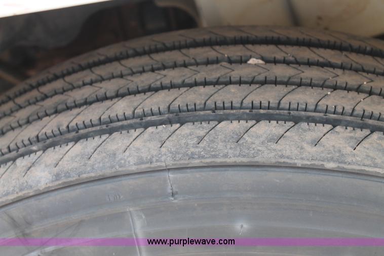 image for item C3934 2003 International DuraStar 4300 flatbed truck with crane