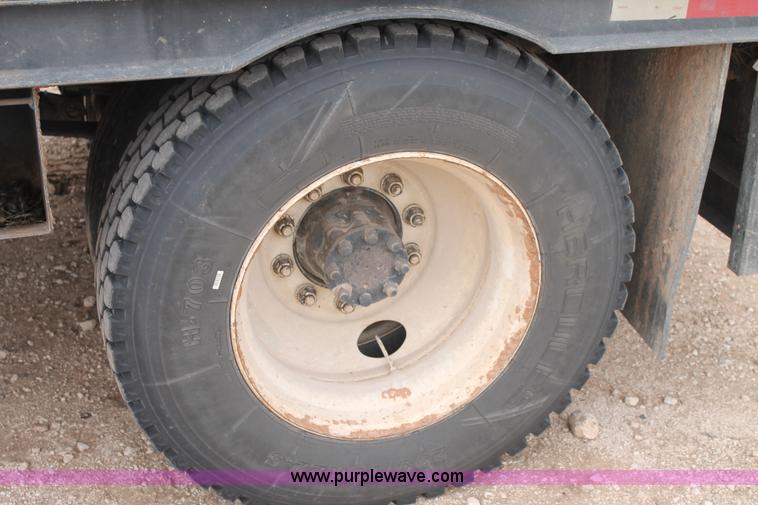 image for item C3934 2003 International DuraStar 4300 flatbed truck with crane