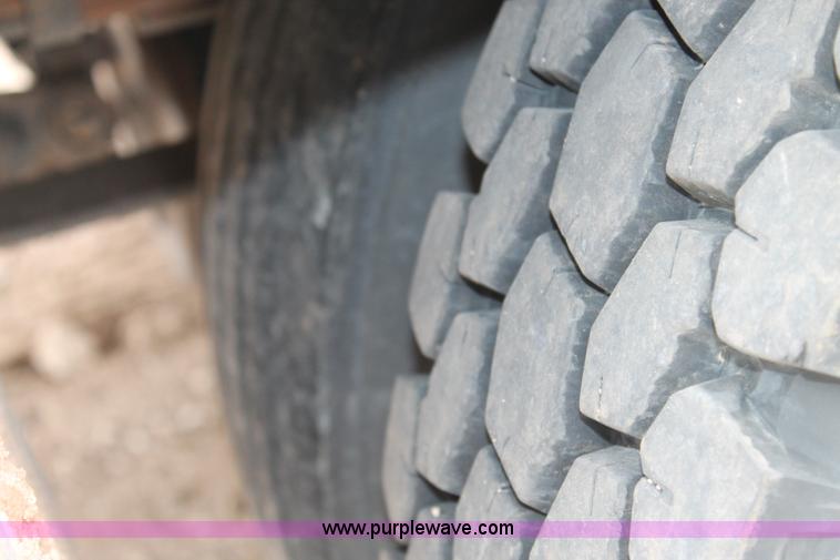 image for item C3934 2003 International DuraStar 4300 flatbed truck with crane