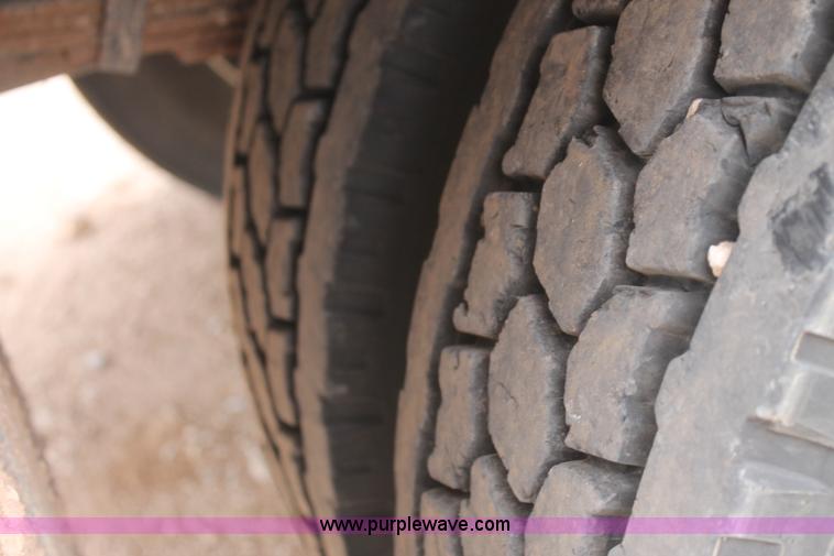 image for item C3934 2003 International DuraStar 4300 flatbed truck with crane