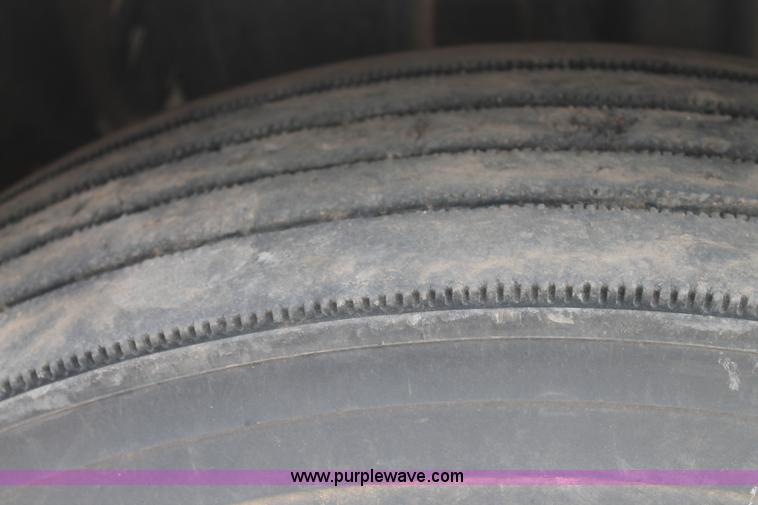 image for item C3934 2003 International DuraStar 4300 flatbed truck with crane