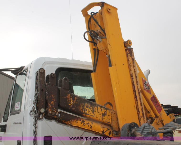 image for item C3934 2003 International DuraStar 4300 flatbed truck with crane
