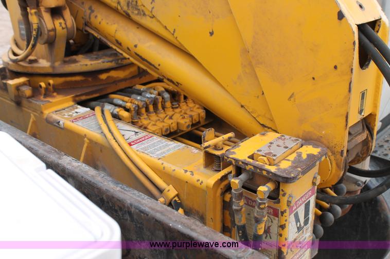 image for item C3934 2003 International DuraStar 4300 flatbed truck with crane