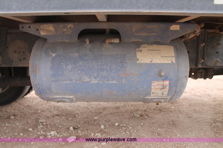 image for item C3934 2003 International DuraStar 4300 flatbed truck with crane