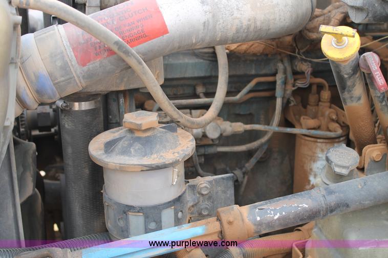 image for item C3934 2003 International DuraStar 4300 flatbed truck with crane