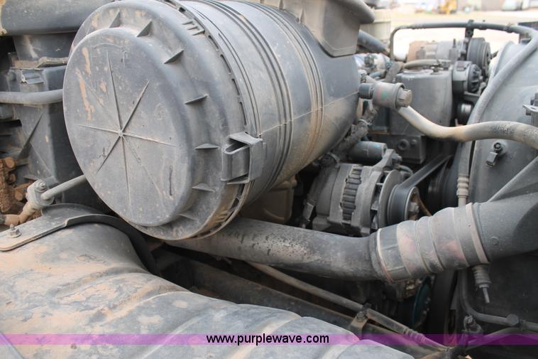 image for item C3934 2003 International DuraStar 4300 flatbed truck with crane