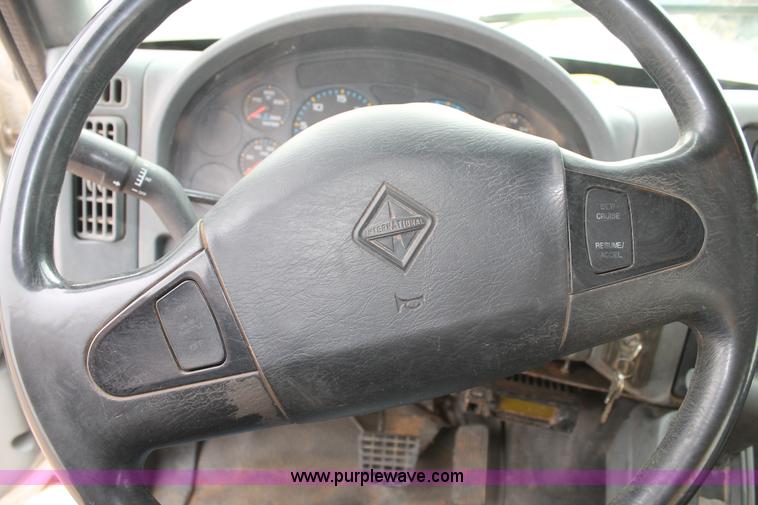 image for item C3934 2003 International DuraStar 4300 flatbed truck with crane