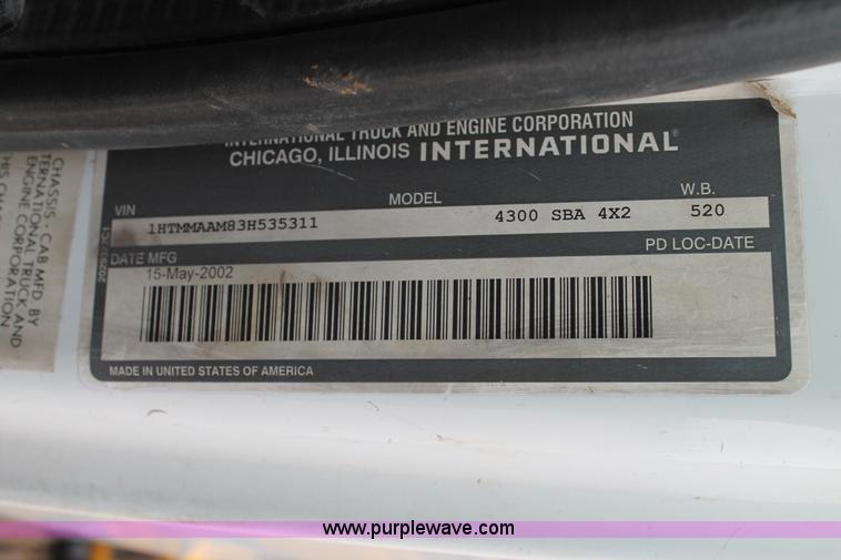 image for item C3934 2003 International DuraStar 4300 flatbed truck with crane