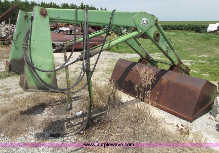 image for item F7445 John Deere 158 tractor loader