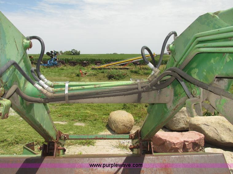 image for item F7445 John Deere 158 tractor loader