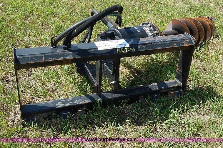 Danuser hydraulic post hole digger skid steer attachment in Blue Rapids