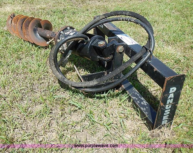 Danuser hydraulic post hole digger skid steer attachment in Blue Rapids, KS Item J2143 sold