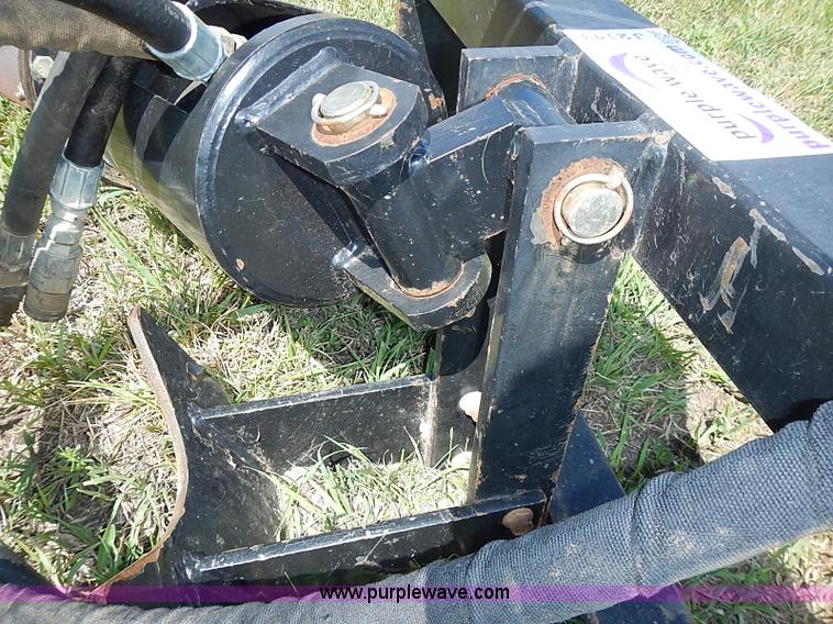Danuser hydraulic post hole digger skid steer attachment in Blue Rapids