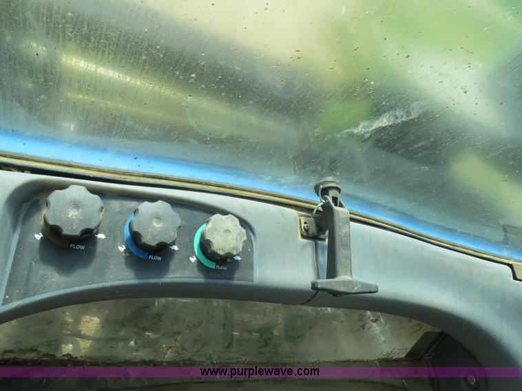 image for item F4968 2007 New Holland TV145 MFWD bi-directional tractor