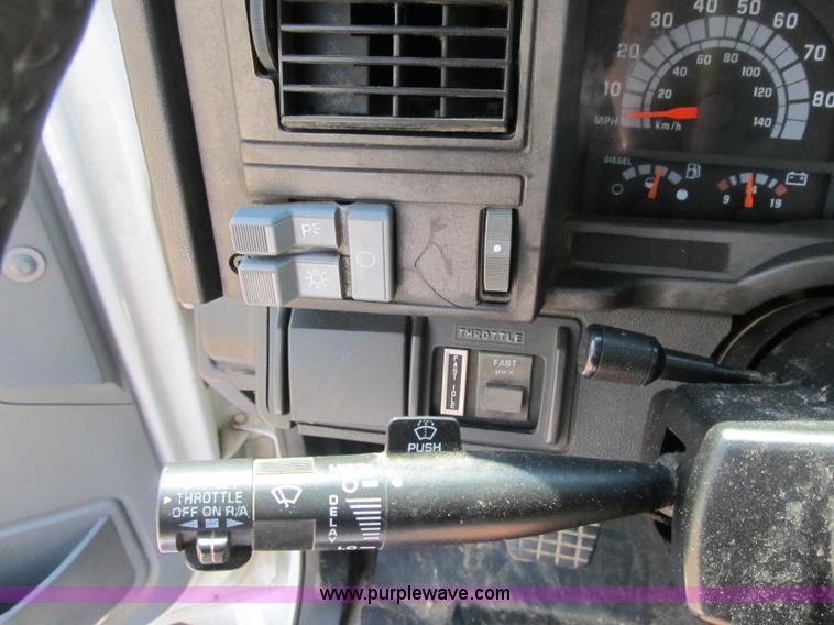 image for item F4931 2000 Chevrolet C7500 flatbed truck with crane