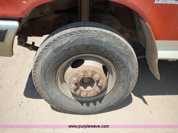 image for item J1206 1991 Ford F450 Super Duty flatbed truck