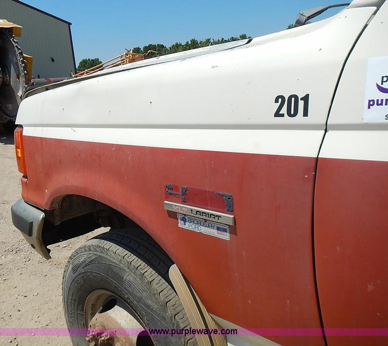 image for item J1206 1991 Ford F450 Super Duty flatbed truck