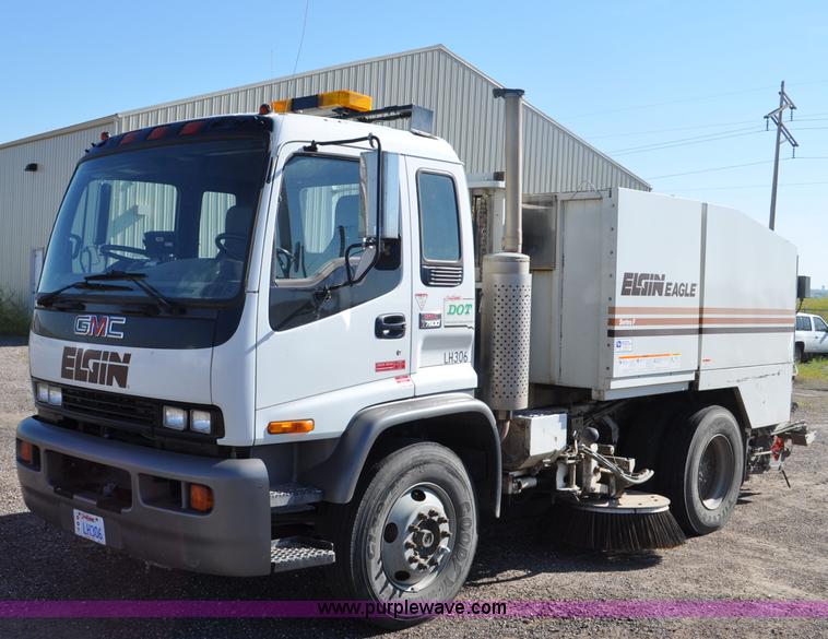image for item F2050 1999 GMC T7500 Elgin street sweeper