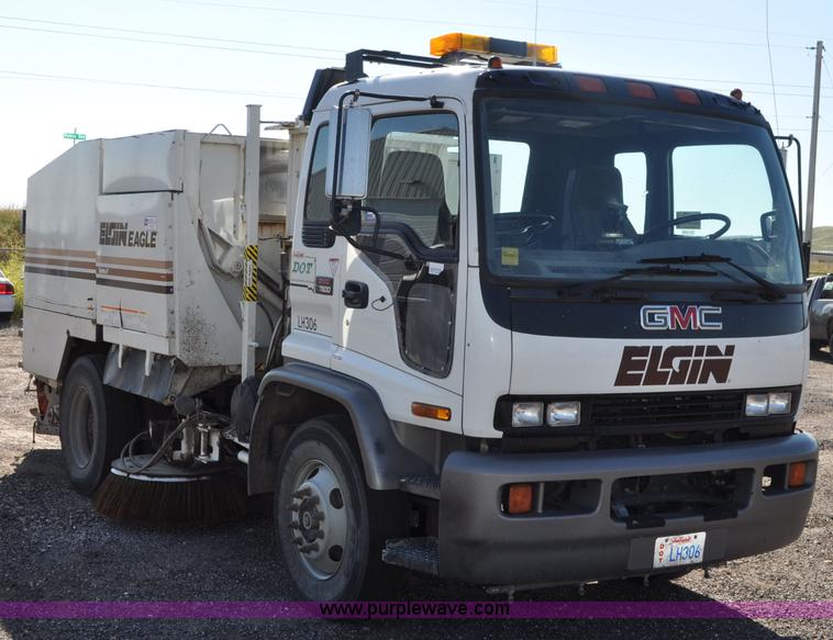 image for item F2050 1999 GMC T7500 Elgin street sweeper