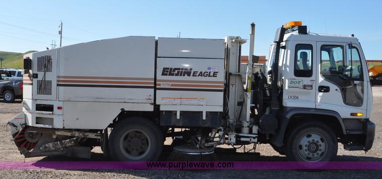image for item F2050 1999 GMC T7500 Elgin street sweeper