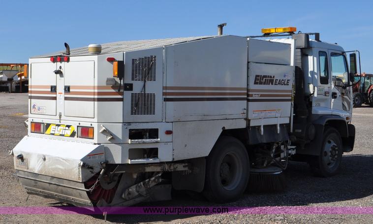 image for item F2050 1999 GMC T7500 Elgin street sweeper