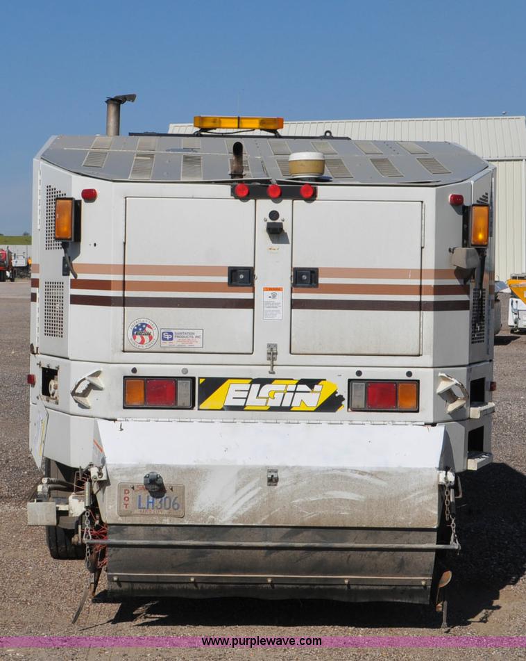 image for item F2050 1999 GMC T7500 Elgin street sweeper