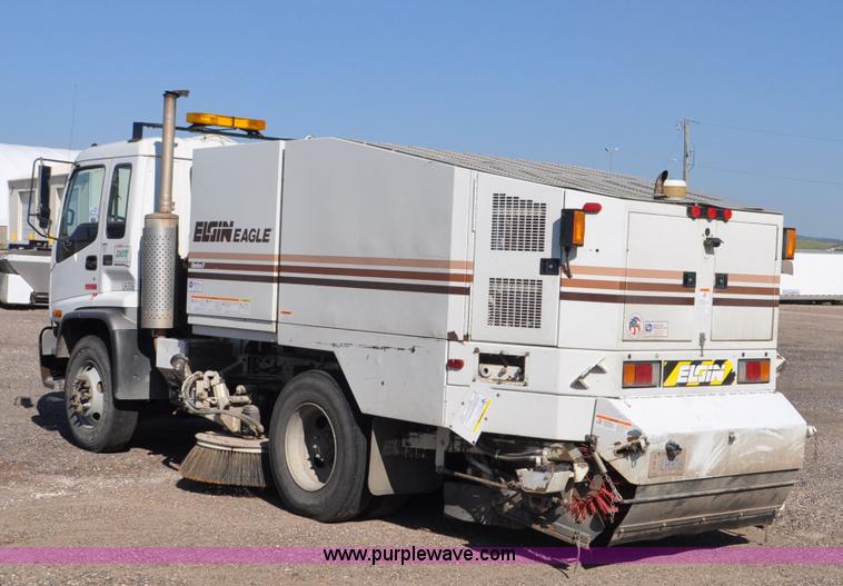 image for item F2050 1999 GMC T7500 Elgin street sweeper