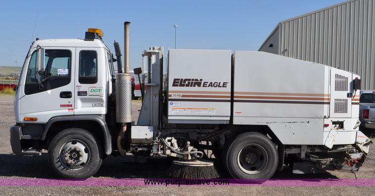 image for item F2050 1999 GMC T7500 Elgin street sweeper