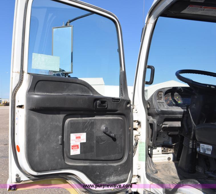 image for item F2050 1999 GMC T7500 Elgin street sweeper