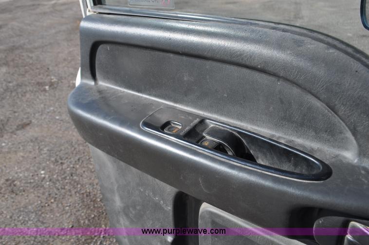 image for item F2050 1999 GMC T7500 Elgin street sweeper