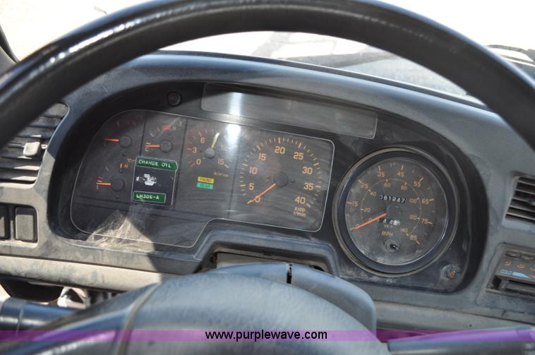 image for item F2050 1999 GMC T7500 Elgin street sweeper