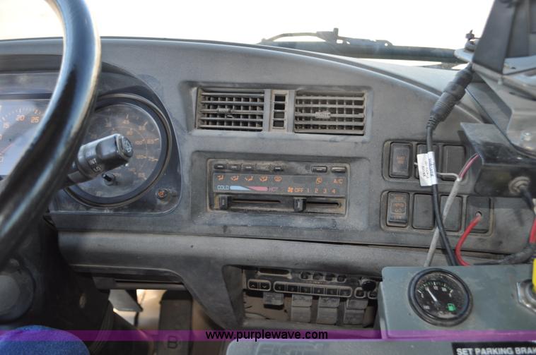 image for item F2050 1999 GMC T7500 Elgin street sweeper