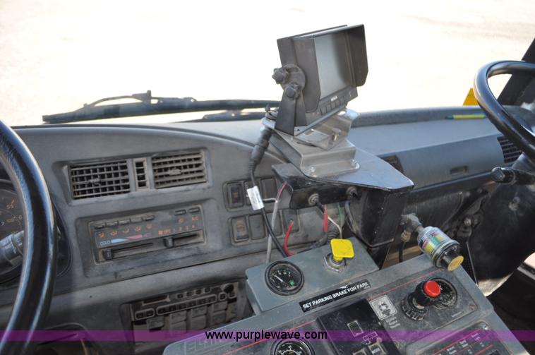 image for item F2050 1999 GMC T7500 Elgin street sweeper