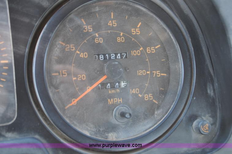 image for item F2050 1999 GMC T7500 Elgin street sweeper