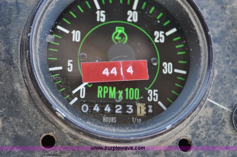 image for item F2050 1999 GMC T7500 Elgin street sweeper