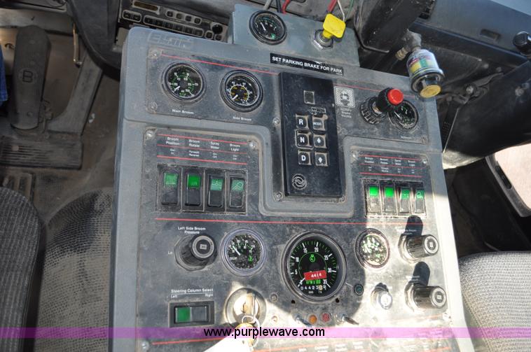 image for item F2050 1999 GMC T7500 Elgin street sweeper