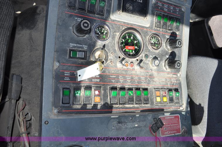 image for item F2050 1999 GMC T7500 Elgin street sweeper