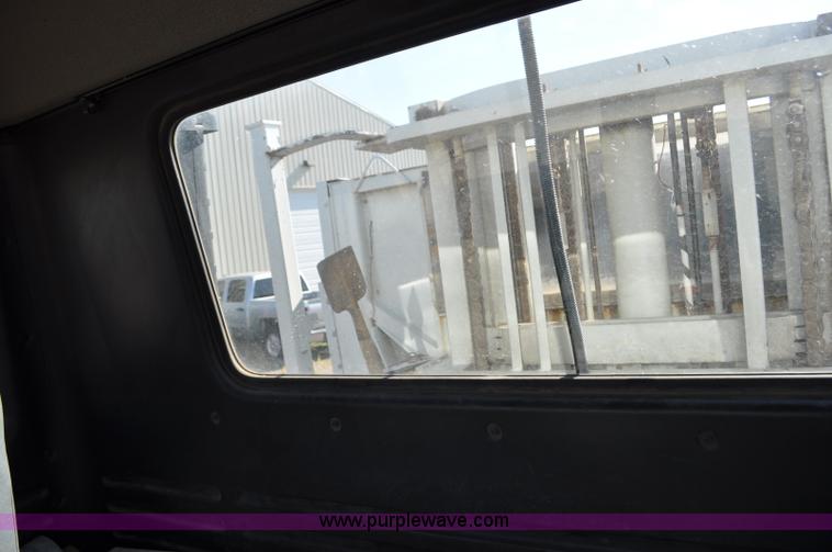 image for item F2050 1999 GMC T7500 Elgin street sweeper