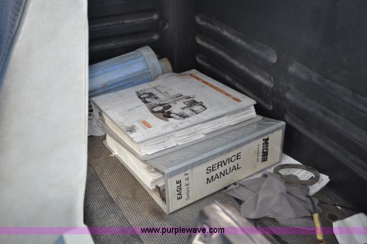 image for item F2050 1999 GMC T7500 Elgin street sweeper