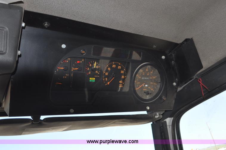 image for item F2050 1999 GMC T7500 Elgin street sweeper